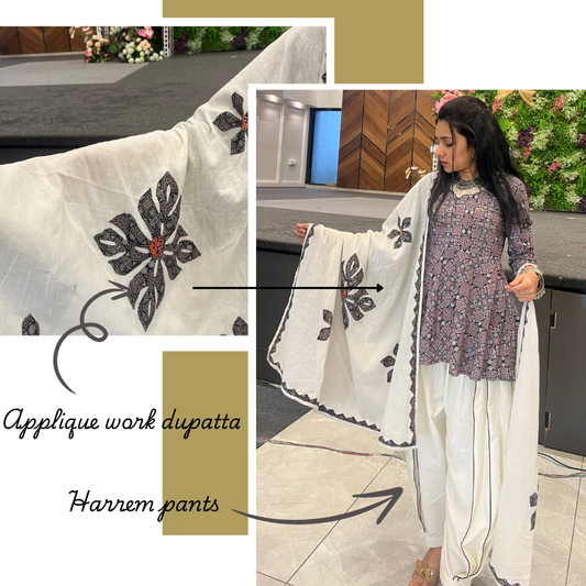 Black Peplum Mirage top with harem pants & applique work dupatta.